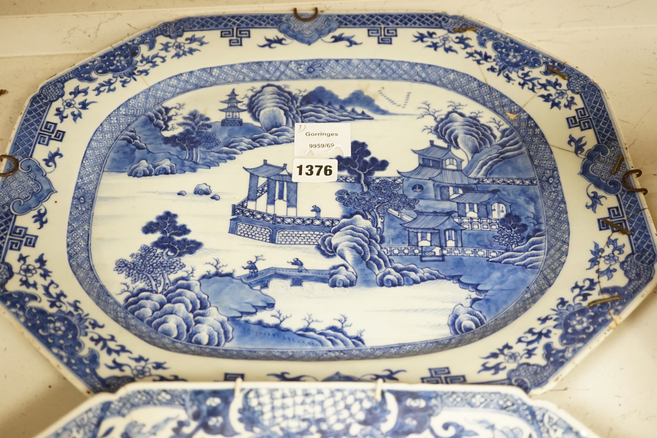 Three 18th century Chinese blue and white meat plates, largest, 41.5cm wide, 35cm deep (a.f.)